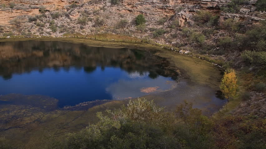 Montezuma Well is a natural limestone sinkhole near the town of Rimrock, Arizona through which some 1,500,000 US gallons of water emerge each day from an underground spring.