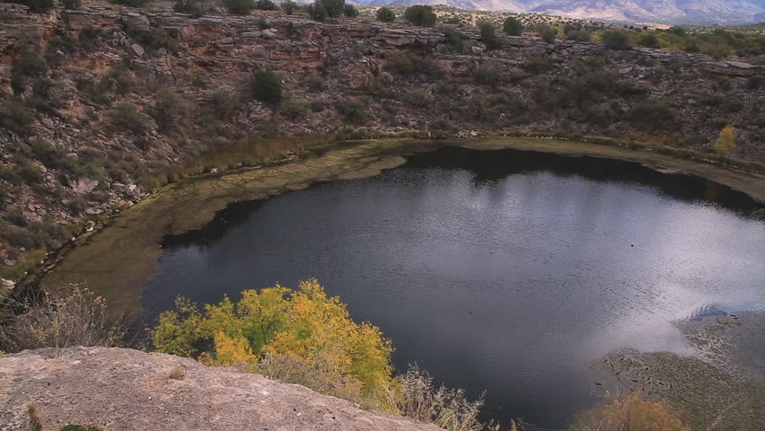 Montezuma Well is a natural limestone sinkhole near the town of Rimrock, Arizona. Ruins of pre historic dwellings are scattered in the rim of the well. 
