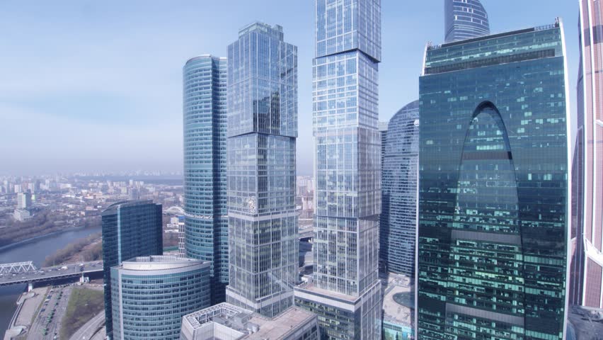 Through glass towers. Aerial shot complex of modern glass office buildings, Moscow-city, 4K Royalty-Free Stock Footage #29906104