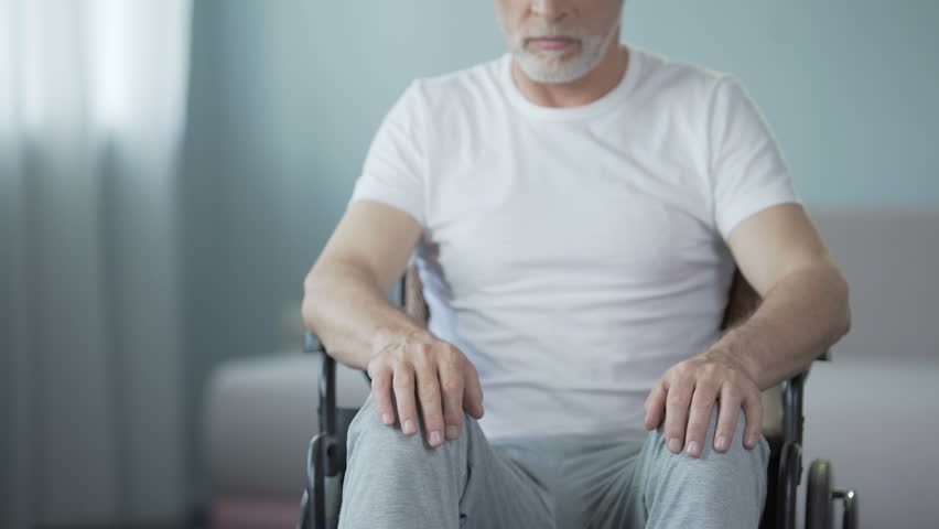 Gray man residing on recovery at medical center after serious spine injury