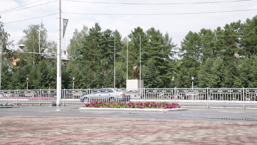 Statue of Lenin in an urban park in Russia - very long shot