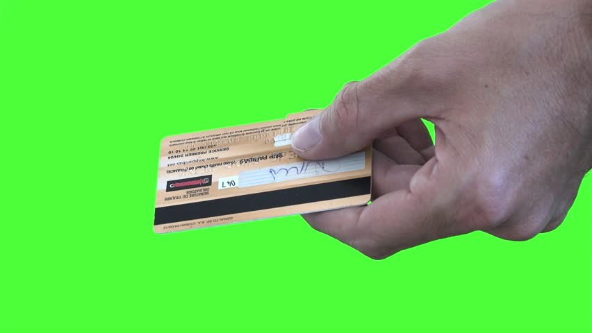 Cutting Credit Card On Green Screen. Male hands cutting a credit card on a green screen background Royalty-Free Stock Footage #29917273