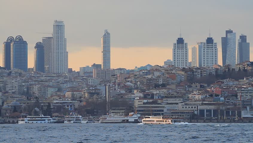 Istanbul city skyline at sunset, showing the buildings rising above Besiktas