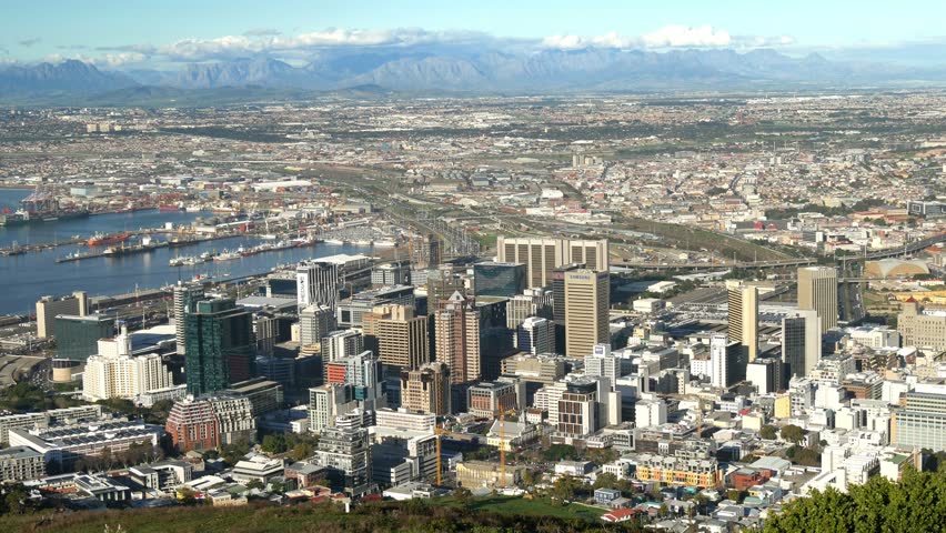 Cape Town South Africa aerial view of City centre, docks, suburbs and Hottentots Holland mountains horizon to blue sky