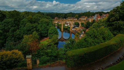 Ultra wide establishing shot of the medieval town of Knaresborough, Yorkshire, England, UK showing the railway viaduct and river Nidd