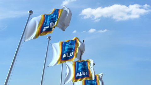 Waving flags with Aldi logo against sky, seamless loop. 4K editorial animation