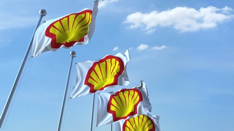 Waving flags with Shell logo against sky, seamless loop. 4K editorial animation