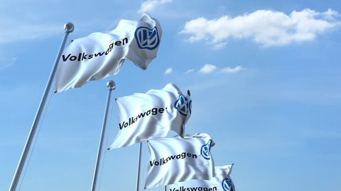Waving flags with Volkswagen logo against sky, seamless loop. 4K editorial animation