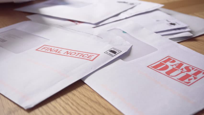 Debt Letters Piling Up with Bills Overdue, Past Due and Final Notice. Red Writing to Represent Economic Struggle, Unemployment, Home Repossession and Recession, Royalty-Free Stock Footage #29937835