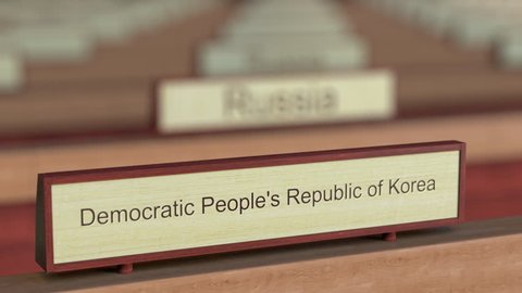 Democratic People's Republic of Korea DPRK name sign among different countries plaques at international organization. 3D rendering