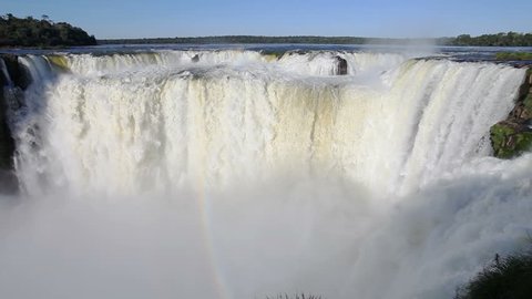 Devil's Throat (Garganta del Diablo) is the biggest of the Iguazu Waterfalls timelapse. Iguazu Falls located on the Iguazu River on the border of the Argentina and the Brazil.