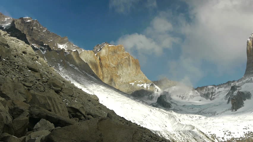Camera pans to reveal towering peaks in Torres del Paine national park