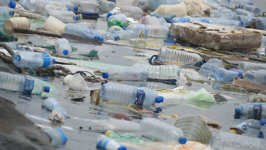 Environmental pollution. Plastic bottles, bags, trash in river, lake. Rubbish and pollution floating in water. Slow motion | Shutterstock HD Video #29954578
