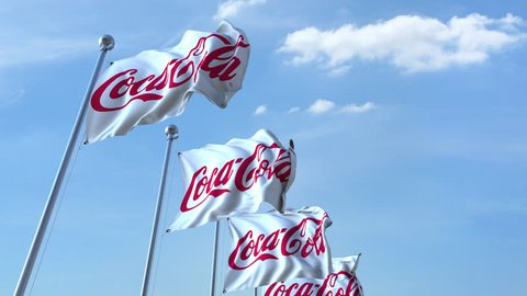 Waving flags with Coca-Cola logo against sky, seamless loop. 4K editorial animation