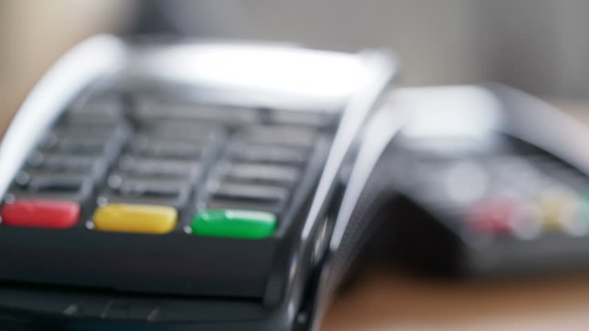 Closeup shot of customer pay over the wireless tradings card-reader. Adult human hands of businessman use bankcard: leans, entering password to withdraw funds then hold and sliding. Noncash payments Royalty-Free Stock Footage #29959108