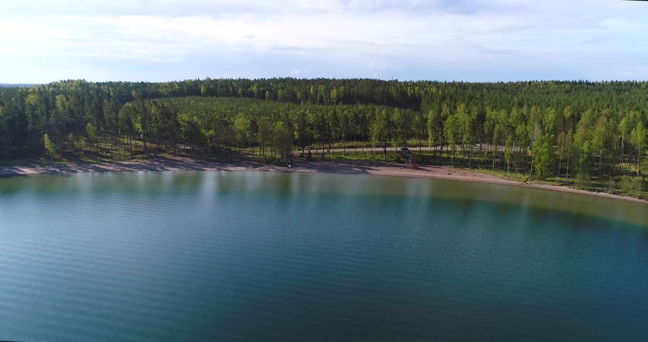 Beach in Finland, Cinema 4k aerial tilt view rising away from olmos beach, on a sunny morning, in Kemionsaari, Uusimaa, Finland 