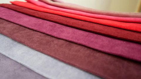 Fabric Samples Of Different Colors In Move Are Spinning And Rotation: Red Different Shades. Textile Textures Fabric Swatches