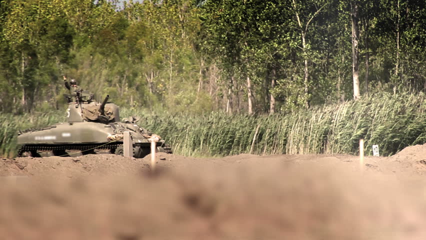 World War Two - American Sherman Firefly drives over sand dunes into battle with German forces