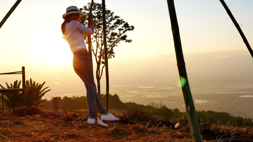 Women swing the rope in evening time.