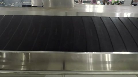 Video footage of empty baggage conveyor belt in the airport