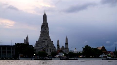 Timelapse of temple of dawn in the sunset with cloudy sky