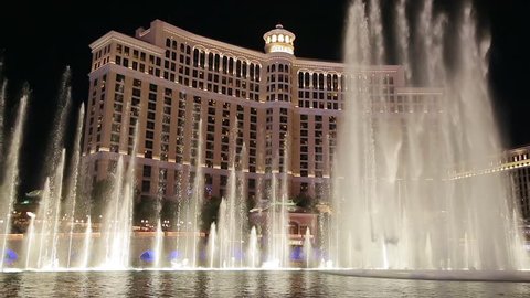 Las Vegas, Nevada - April 2017: Bellagio water fountain show in Las Vegas with original surround sound. Bellagio fountain water show at night. Bellagio Hotel Casino by night, Las Vegas Famous Show.