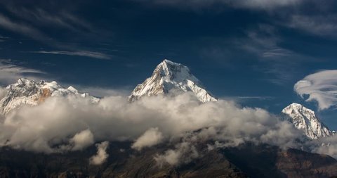 4k time lapse with beautiful clouds over Annapurna South with beautiful colours. Himalaya Mountain, Nepal