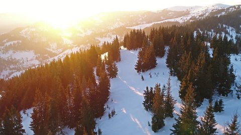 Aerial view in sunrise winter mountain