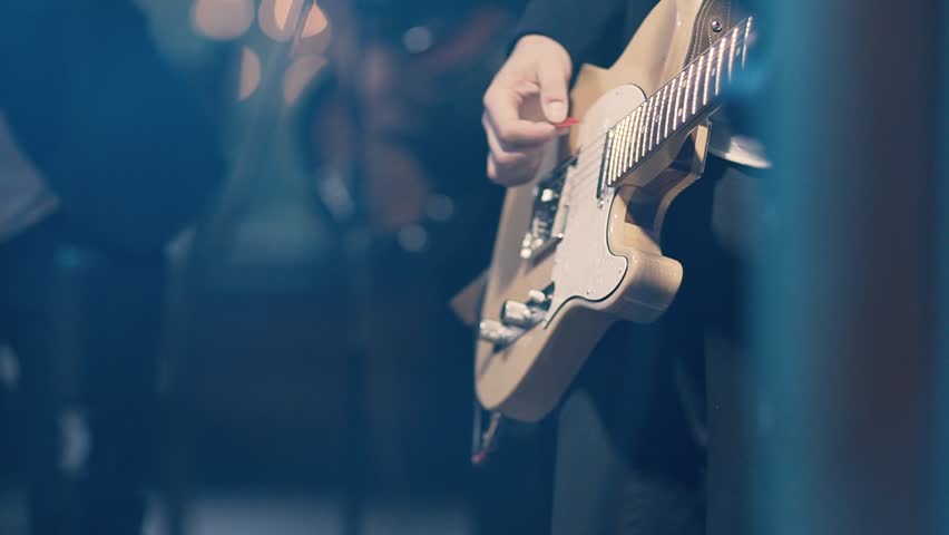 Man Playing on Electric Guitar. Slow Motion Instrument Playing Band of Men Royalty-Free Stock Footage #30026455