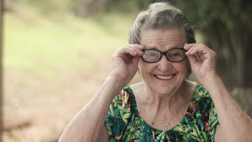 Joyful senior lady in glasses laughing | Shutterstock HD Video #30029380