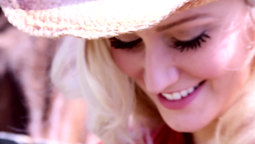 Blonde cowgirl smiles