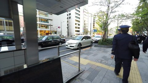TOKYO, JAPAN - APRIL 28, 2017: POV outside Tokyo Station Police book Driver