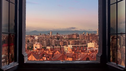 madrid city seen through a window timelapse day to night