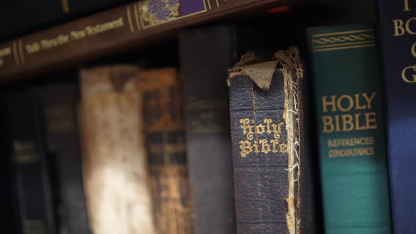 Pulling Holy Bible Antique Leather Book off Shelf Close Up, 4K Royalty-Free Stock Footage #30073195
