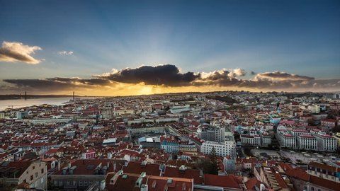Amazing aerial sunset timelapse of sun rays over the Lisbon cityscape (Baixa district). Portugal. April, 2017