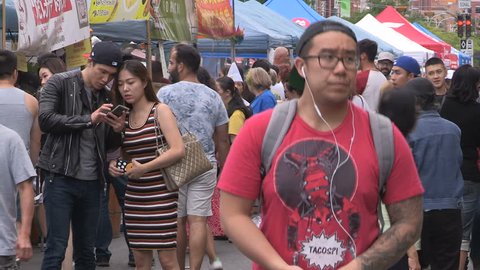 Toronto, Ontario, Canada August 2017 Chinatown market district crowded with people and vendors