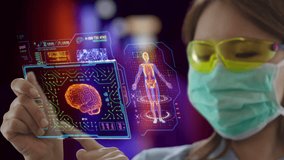 Young Asian female doctor wearing protective mask uses futuristic touchscreen holographic device to access patient's data at the hospital - Powered by Shutterstock - Get 15% off with code: PIKWIZARD15