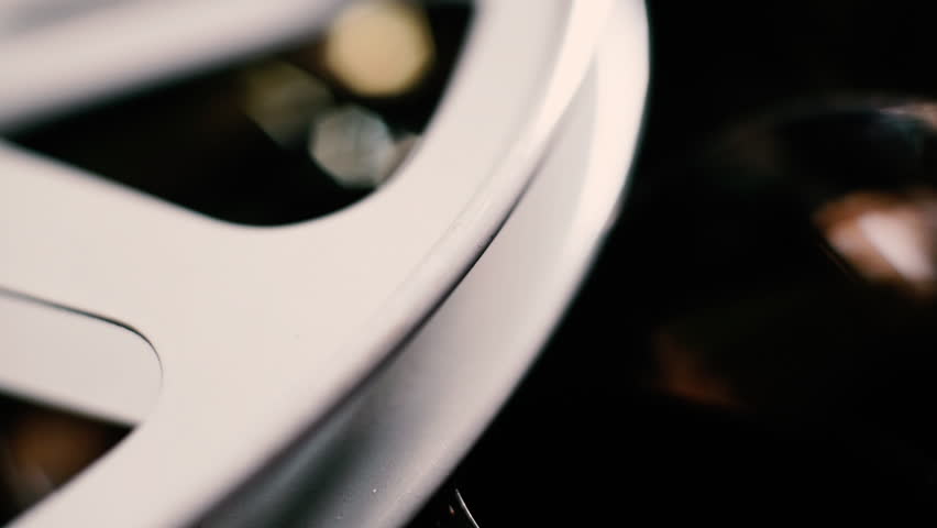 Concept of vintage movie, reel and filmstrip objects detail short depth of focus right to left panning