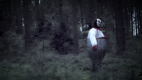 4K Halloween Horror Clown in Forest Walking