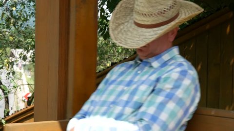 Tired Farmer Sleeping and Swinging in a Wooden Rocking Chair (Ultra High Definition, UltraHD, Ultra HD, UHD, 4K, 3840x2160)