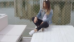 Stylish female teen model sitting in pose for camera 4K