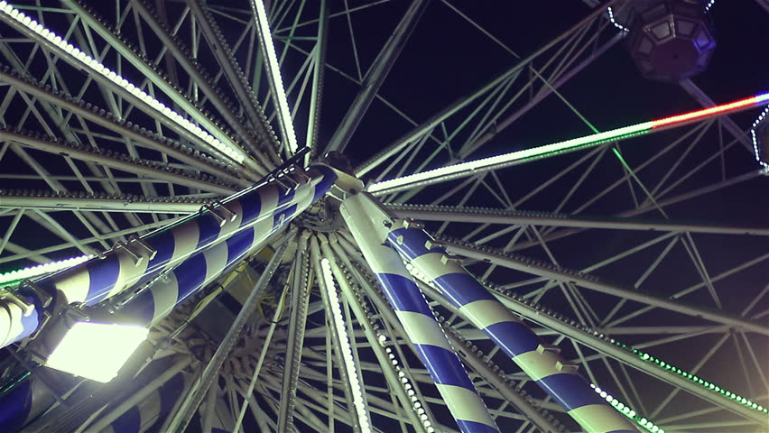 Ferris wheel in amusement park at night