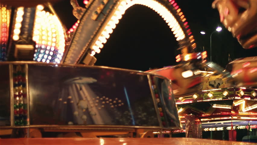Carousels in amusement park at night