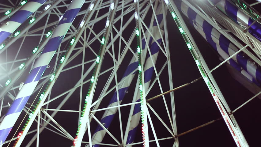 Ferris wheel in amusement park at night