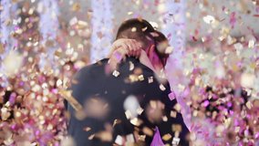 Young beautiful bride and groom dancing first dance at the wedding party shrouded by confetti. Wedding bouquet. Feel happy. - Powered by Shutterstock - Get 15% off with code: PIKWIZARD15
