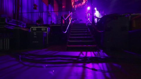 POV of musician entering a stage through stairs for sound check before concert
