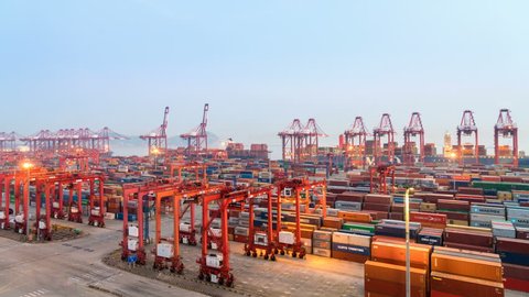 SHANGHAI, CHINA - Aug 21, 2017: Time lapse of Shipping Container Terminal in Nightfall, Busy modern harbor in Yangshan deep water port. August 21, 2017 in Shanghai ,China.
