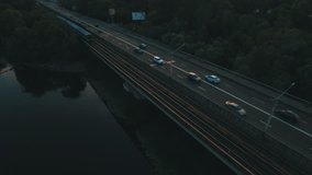 Subway and cars bridge.Cityscape on dusk aerial drone footage