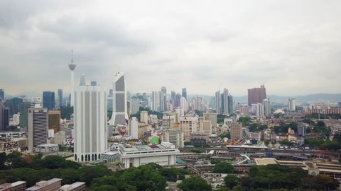 Malaysia, Circa 2017 - Aerial footage of Kuala Lumpur city on a cloudy day. Dayabumi Building, Maybank, KL Tower and Petronas Towers visible. Malaysia is forecasting a 5% GDP this year.