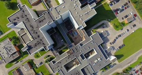 Establishing shot, big modern imposing building, may represent company headquarters, bank, hospital, state foundation, etc. aerial view.